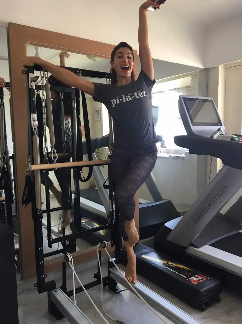 Jacqueline Fernandez  in a charcoal Pilates T-Shirt of radhika balanced body - Delivered in 