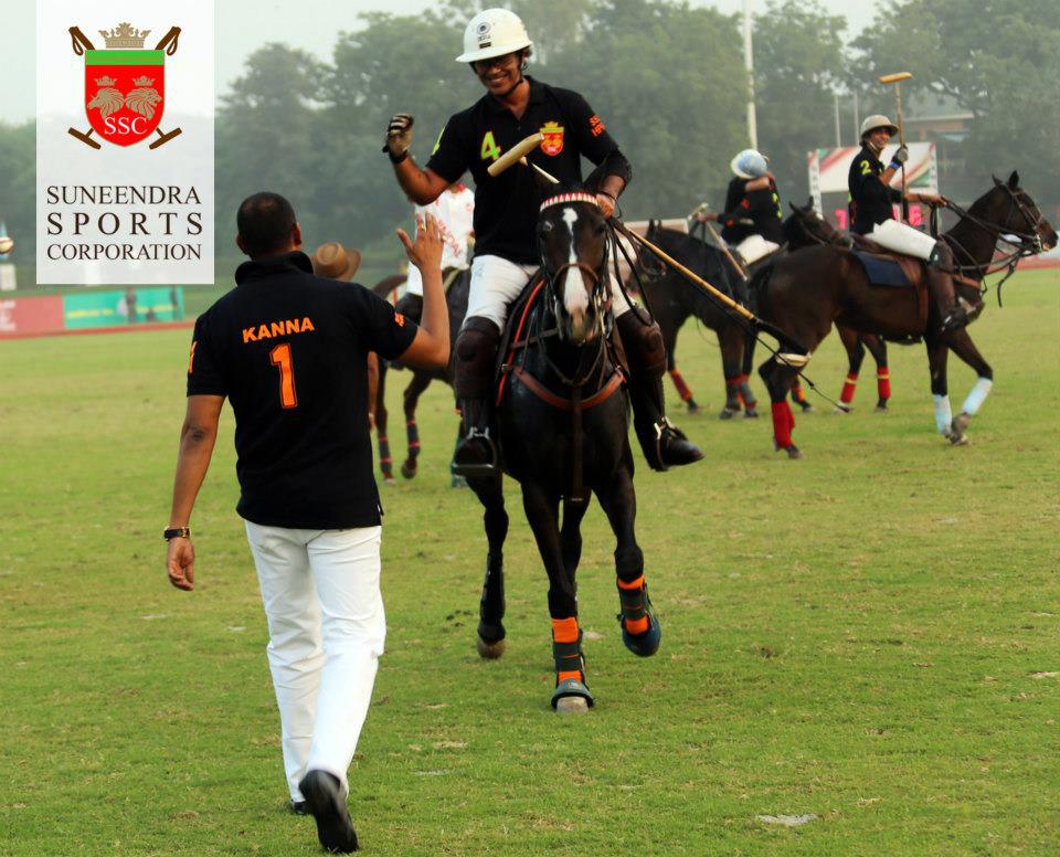 Sunendra Polo Team wearing black embroidered polo shirt - Delivered in 